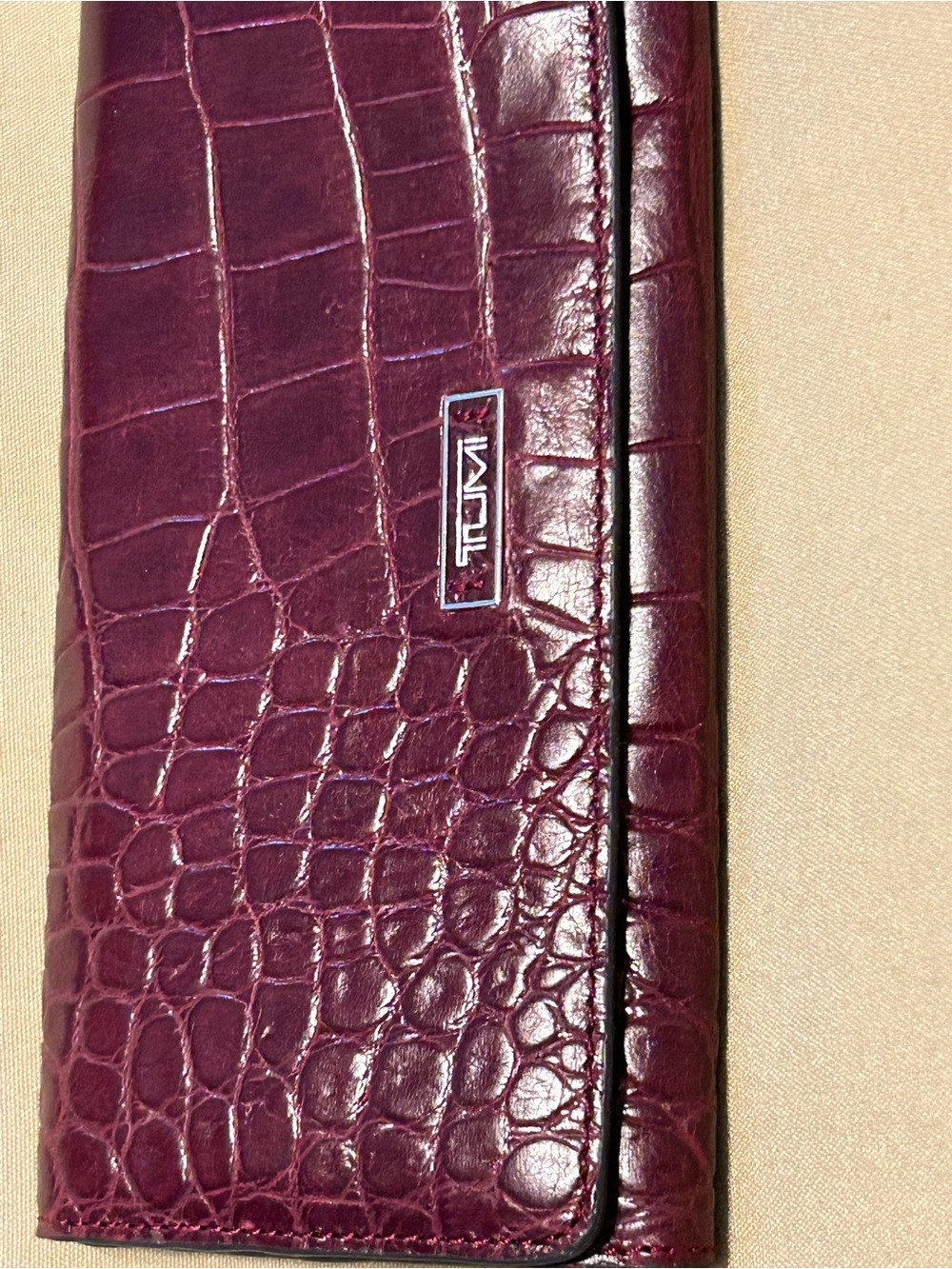 Tumi Croc-Embossed Leather Clutch Wallet. Burgundy oxblood color.